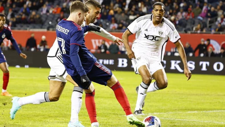 Apr 1, 2023; Chicago, Illinois, USA; Chicago Fire midfielder Brian Gutierrez (17) attempts to shoot the ball against D.C. United during the first half at Soldier Field. Mandatory Credit: Mike Dinovo-USA TODAY Sports