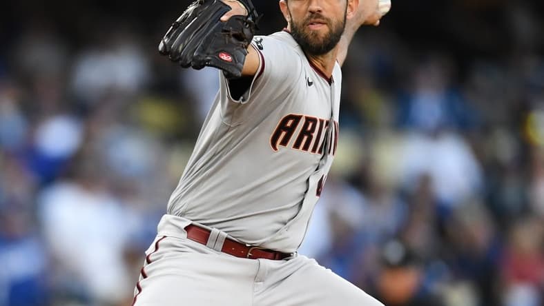 Apr 1, 2023; Los Angeles, California, USA; Arizona Diamondbacks starting pitcher Madison Bumgarner (40) throws a pitch against the Los Angeles Dodgers during the first inning at Dodger Stadium. Mandatory Credit: Jonathan Hui-USA TODAY Sports