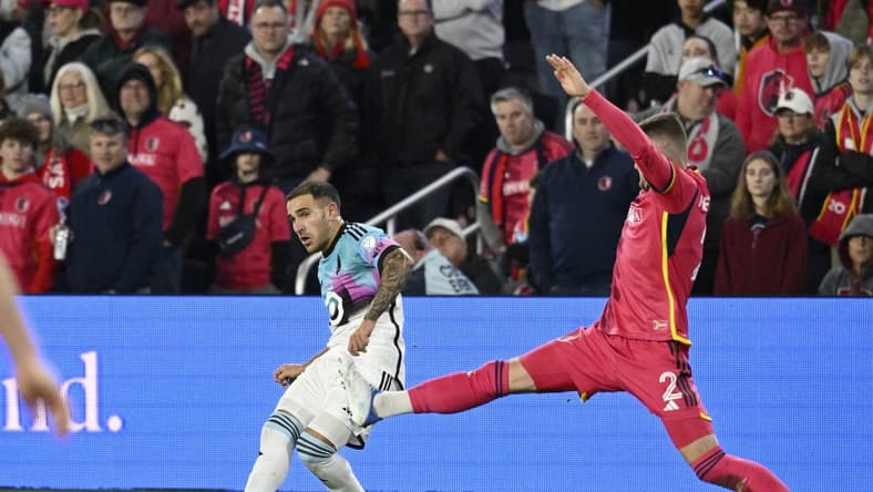 Apr 1, 2023; St. Louis, Missouri, USA; Minnesota United midfielder Franco Fragapane (7) plays the ball defended by St. Louis City defender Jake Nerwinski (2) in the first half at CITYPARK. Mandatory Credit: Scott Rovak-USA TODAY Sports