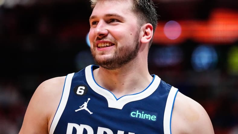 Apr 1, 2023; Miami, Florida, USA; Dallas Mavericks guard Luka Doncic (77) reacts to a foul against the Miami Heat during the third quarter at Miami-Dade Arena. Mandatory Credit: Rich Storry-USA TODAY Sports