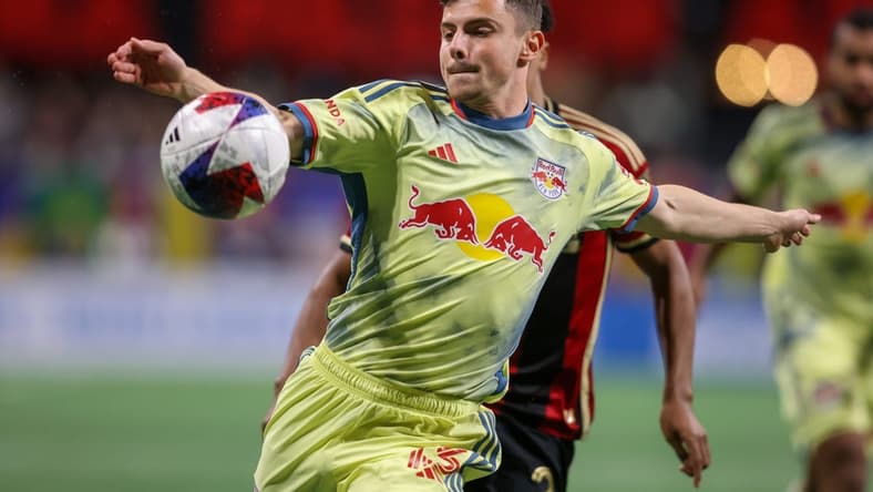 Apr 1, 2023; Atlanta, Georgia, USA; New York Red Bulls forward Dante Vanzeir (13) kicks the ball against Atlanta United in the second half at Mercedes-Benz Stadium. Mandatory Credit: Brett Davis-USA TODAY Sports