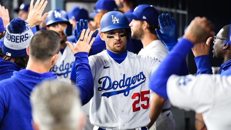 Apr 1, 2023; Los Angeles, California, USA; Los Angeles Dodgers center fielder Trayce Thompson (25) celebrates with teammates in the dugout after hitting a home run against the Arizona Diamondbacks during the fifth inning at Dodger Stadium. Mandatory Credit: Jonathan Hui-USA TODAY Sports