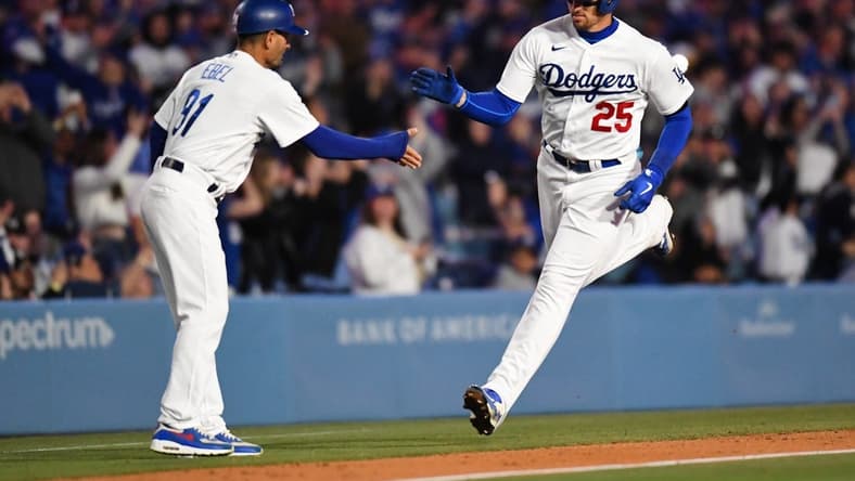 Apr 1, 2023; Los Angeles, California, USA; Los Angeles Dodgers center fielder Trayce Thompson (25) celebrates with third base coach Dino Ebel (91) against the Arizona Diamondbacks during the eighth inning at Dodger Stadium. Mandatory Credit: Jonathan Hui-USA TODAY Sports