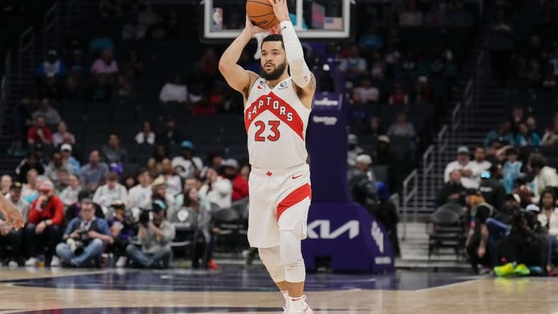 Apr 2, 2023; Charlotte, North Carolina, USA; Toronto Raptors guard Fred VanVleet (23) passes the ball off during first quarter against the Charlotte Hornets at Spectrum Center. Mandatory Credit: Jim Dedmon-USA TODAY Sports