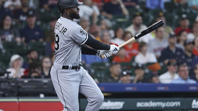 Apr 2, 2023; Houston, Texas, USA; Chicago White Sox center fielder Luis Robert Jr. (88) hits a double during the first inning against the Houston Astros at Minute Maid Park. Mandatory Credit: Troy Taormina-USA TODAY Sports