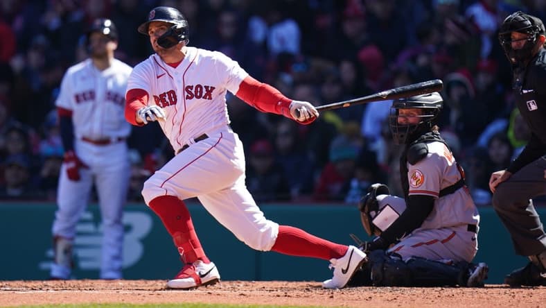 Apr 2, 2023; Boston, Massachusetts, USA; Boston Red Sox center fielder Adam Duvall (18) hits a double against the Baltimore Orioles in the third inning at Fenway Park. Mandatory Credit: David Butler II-USA TODAY Sports