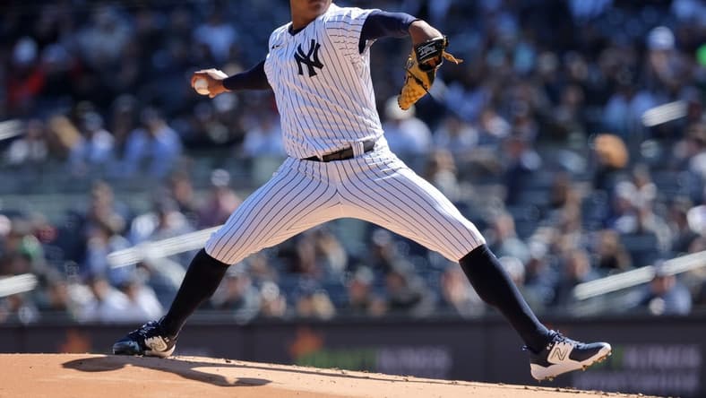 Apr 2, 2023; Bronx, New York, USA; New York Yankees starting pitcher Jhony Brito (76) pitches against the San Francisco Giants during the first inning at Yankee Stadium. Mandatory Credit: Brad Penner-USA TODAY Sports
