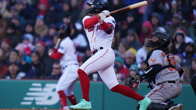 Apr 2, 2023; Boston, Massachusetts, USA; Boston Red Sox shortstop Enrique Hernandez (5) singles to right field to drive in a run against the Baltimore Orioles in the seventh inning at Fenway Park. Mandatory Credit: David Butler II-USA TODAY Sports