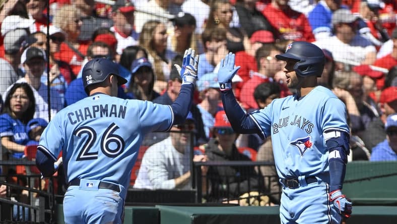 Apr 2, 2023; St. Louis, Missouri, USA;  Toronto Blue Jays third baseman Matt Chapman (26) is congratulated by right fielder George Springer (4) after scoring against the St. Louis Cardinals during the second inning at Busch Stadium. Mandatory Credit: Jeff Curry-USA TODAY Sports