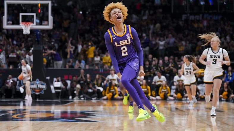 Apr 2, 2023; Dallas, TX, USA; LSU Lady Tigers guard Jasmine Carson (2) yells as she runs on the court in the game against the Iowa Hawkeyes in the first half during the final round of the Women's Final Four NCAA tournament at the American Airlines Center. Mandatory Credit: Kirby Lee-USA TODAY Sports