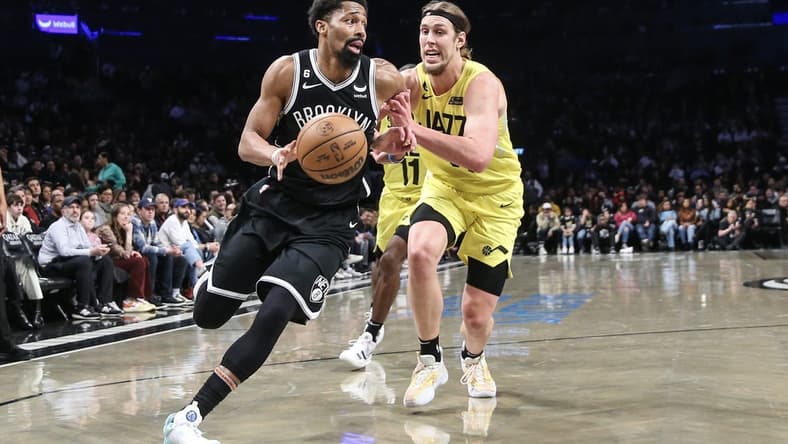 Apr 2, 2023; Brooklyn, New York, USA;  Brooklyn Nets guard Spencer Dinwiddie (26) looks to drive past Utah Jazz forward Kelly Olynyk (41) in the second quarter at Barclays Center. Mandatory Credit: Wendell Cruz-USA TODAY Sports