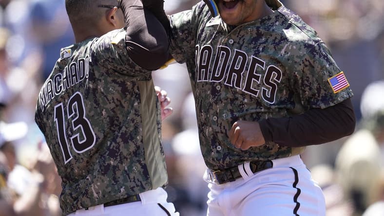 Apr 2, 2023; San Diego, California, USA;  San Diego Padres center fielder Trent Grisham (right) celebrates his home run with third baseman Manny Machado (13) against the Colorado Rockies during the first inning at Petco Park. Mandatory Credit: Ray Acevedo-USA TODAY Sports