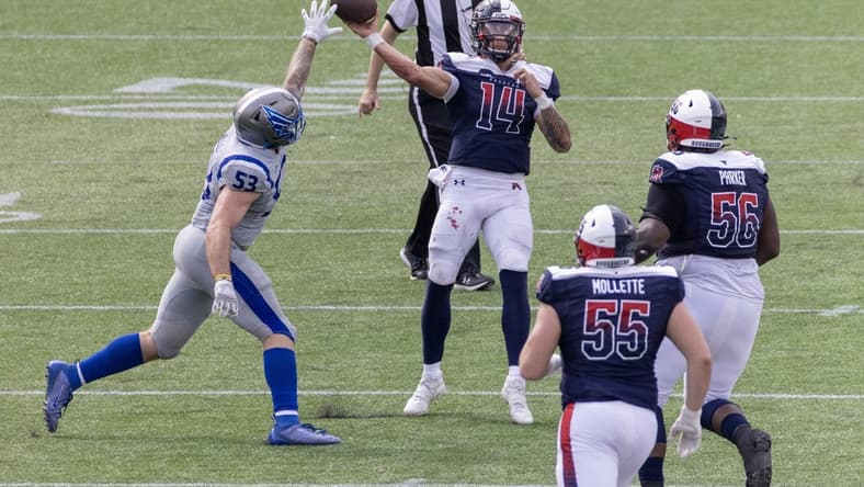 Apr 2, 2023; Houston, TX, USA; Houston Roughnecks quarterback Cole McDonald (14) pass is deflected by St. Louis Battlehawks linebacker Carson Wells (53) in the fourth quarter at TDECU Stadium. Mandatory Credit: Thomas Shea-USA TODAY Sports