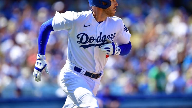 Apr 2, 2023; Los Angeles, California, USA; Los Angeles Dodgers first baseman Freddie Freeman (5) runs after hitting a single against the Arizona Diamondbacks during the fifth inning at Dodger Stadium. Mandatory Credit: Gary A. Vasquez-USA TODAY Sports