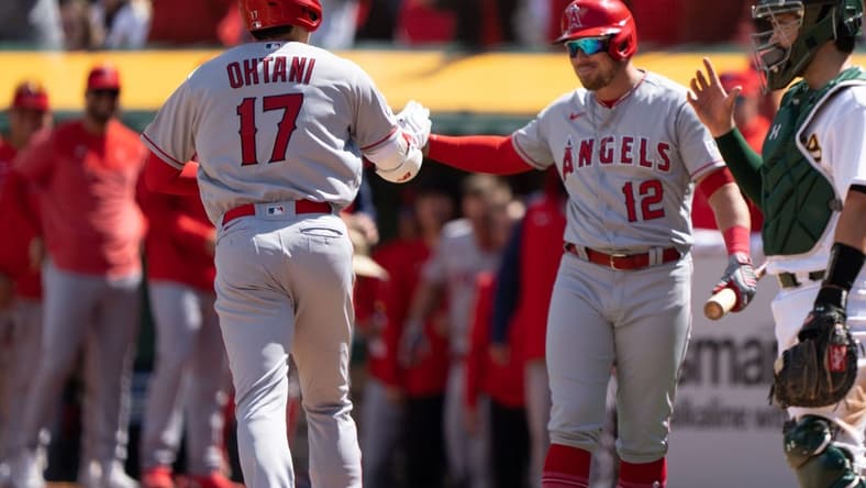 Apr 2, 2023; Oakland, California, USA;  Los Angeles Angels designated hitter Shohei Ohtani (17) celebrates with right fielder Hunter Renfroe (12) after hitting a solo home run during the fifth inning against the Oakland Athletics at RingCentral Coliseum. Mandatory Credit: Stan Szeto-USA TODAY Sports