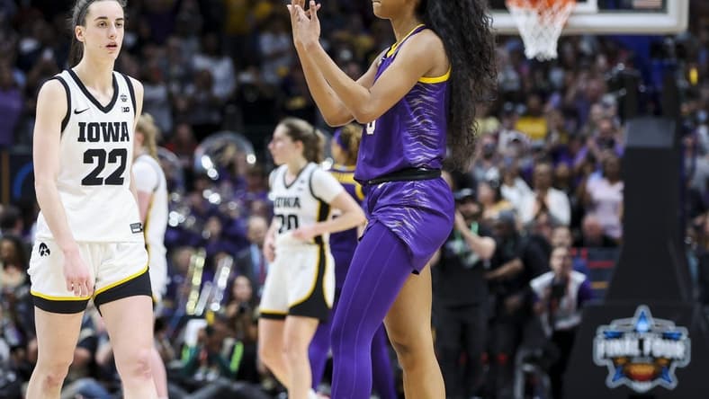 Apr 2, 2023; Dallas, TX, USA; LSU Lady Tigers forward Angel Reese (10) gestures towards Iowa Hawkeyes guard Caitlin Clark (22) in the second half during the final round of the Women's Final Four NCAA tournament at the American Airlines Center. Mandatory Credit: Kevin Jairaj-USA TODAY Sports