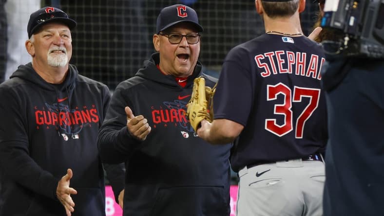 Apr 2, 2023; Seattle, Washington, USA; Cleveland Guardians hitting coach Chris Valaika (left) and manager Terry Francona (second from left) greet relief pitcher Trevor Stephan (37) following a 6-5 victory against the Seattle Mariners in ten innings at T-Mobile Park. Mandatory Credit: Joe Nicholson-USA TODAY Sports