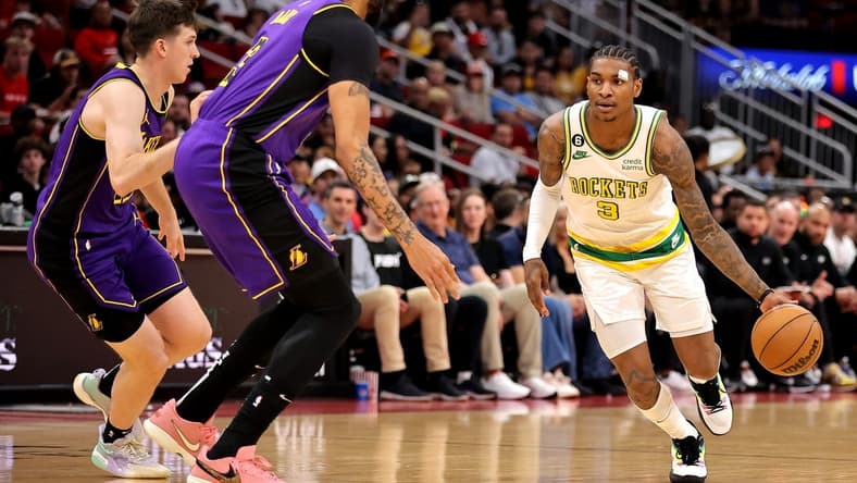 Apr 2, 2023; Houston, Texas, USA; Houston Rockets guard Kevin Porter Jr. (3) handles the ball against Los Angeles Lakers forward Anthony Davis (3) during the first quarter at Toyota Center. Mandatory Credit: Erik Williams-USA TODAY Sports