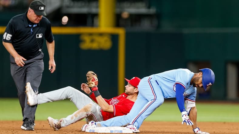 Apr 2, 2023; Arlington, Texas, USA; Texas Rangers second baseman Marcus Semien (2) is thrown out at 2nd against the Philadelphia Phillies at Globe Life Field. Mandatory Credit: Andrew Dieb-USA TODAY Sports