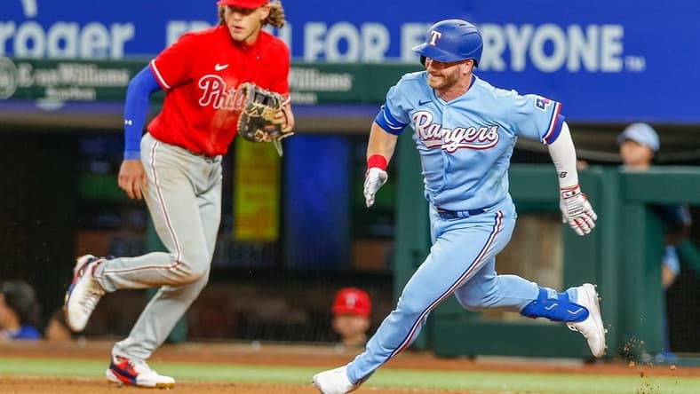 Apr 2, 2023; Arlington, Texas, USA; Texas Rangers right fielder Robbie Grossman (4) rounds first base during the seventh inning against the Philadelphia Phillies at Globe Life Field. Mandatory Credit: Andrew Dieb-USA TODAY Sports