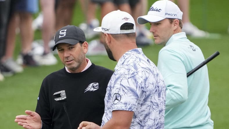 Apr 3, 2023; Augusta, Georgia, USA; Sergio Garcia (from left), Jon Rahm and Russell Henley talk at the practice facility during a practice round for The Masters golf tournament at Augusta National Golf Club. Mandatory Credit: Danielle Parhizkaran-USA TODAY Network
Pga The Masters Practice Round