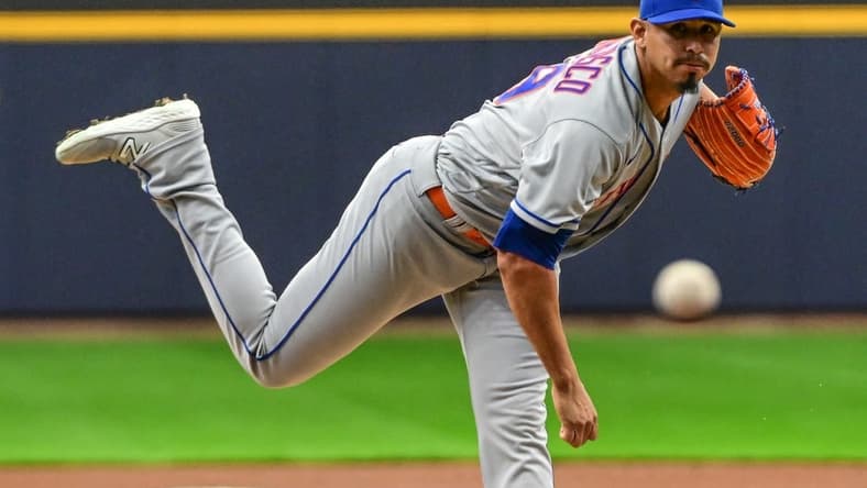 Apr 3, 2023; Milwaukee, Wisconsin, USA; New York Mets pitcher Carlos Carrasco (59) throws a pitch in the in the first inning against the Milwaukee Brewers at American Family Field. Mandatory Credit: Benny Sieu-USA TODAY Sports