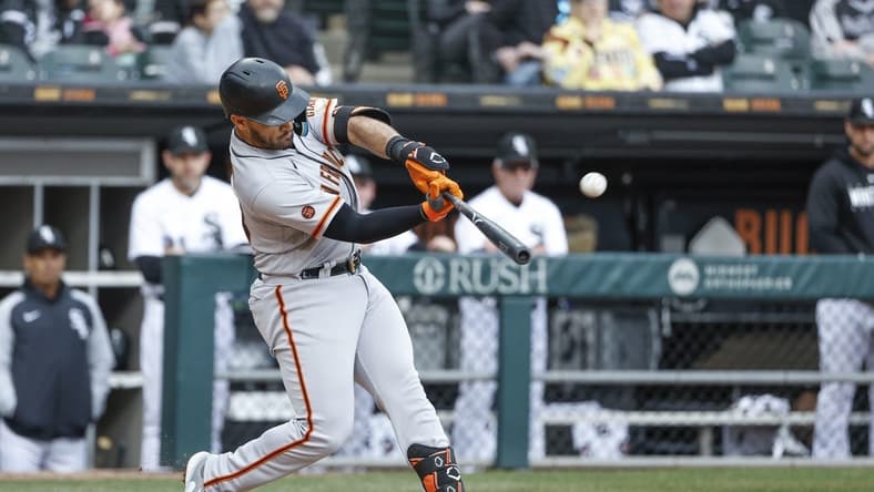 Apr 3, 2023; Chicago, Illinois, USA; San Francisco Giants third baseman David Villar (32) hits a solo home run against the Chicago White Sox during the fifth inning at Guaranteed Rate Field. Mandatory Credit: Kamil Krzaczynski-USA TODAY Sports