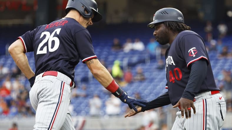 Apr 3, 2023; Miami, Florida, USA;  Minnesota Twins right fielder Max Kepler (26) is congratulated by third base coach coach Tommy Watkins (40) after his home run against the Miami Marlins during the first inning at loanDepot Park. Mandatory Credit: Rhona Wise-USA TODAY Sports