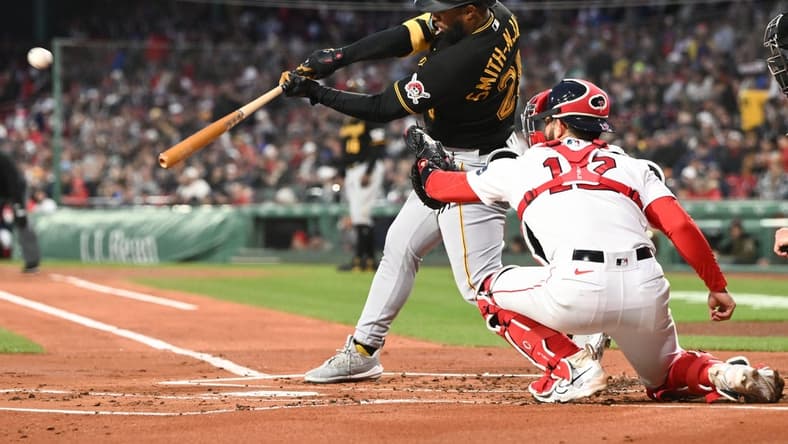 Apr 3, 2023; Boston, Massachusetts, USA; Pittsburgh Pirates right fielder Canaan Smith-Njigba (28) hits a two-run home run against the Boston Red Sox during the first inning at Fenway Park. Mandatory Credit: Brian Fluharty-USA TODAY Sports