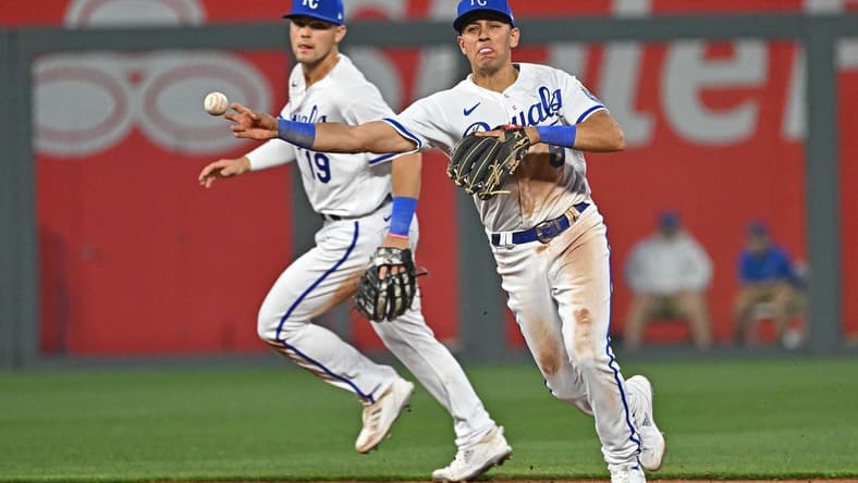 Apr 3, 2023; Kansas City, Missouri, USA;  Kansas City Royals shortstop Nicky Lopez (8) throws to first base for an out during the fifth inning against the Toronto Blue Jays at Kauffman Stadium. Mandatory Credit: Peter Aiken-USA TODAY Sports