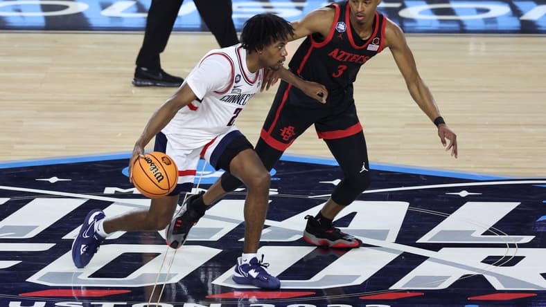 Apr 3, 2023; Houston, TX, USA; Connecticut Huskies guard Tristen Newton (2) shoots the ball as San Diego State Aztecs guard Micah Parrish (3) defends during the first half in the national championship game of the 2023 NCAA Tournament at NRG Stadium. Mandatory Credit: Troy Taormina-USA TODAY Sports