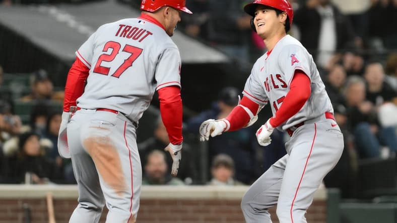 Apr 3, 2023; Seattle, Washington, USA; Los Angeles Angels center fielder Mike Trout (27) and Los Angeles Angels designated hitter Shohei Ohtani (17) celebrate after Ohtani hit a two-run home run against the Seattle Mariners during the fifth inning at T-Mobile Park. Mandatory Credit: Steven Bisig-USA TODAY Sports