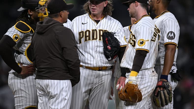 Apr 3, 2023; San Diego, California, USA; San Diego Padres starting pitcher Ryan Weathers (center) meets with pitching coach Ruben Niebla (front, left) at the mound during the third inning against the Arizona Diamondbacks at Petco Park. Mandatory Credit: Orlando Ramirez-USA TODAY Sports