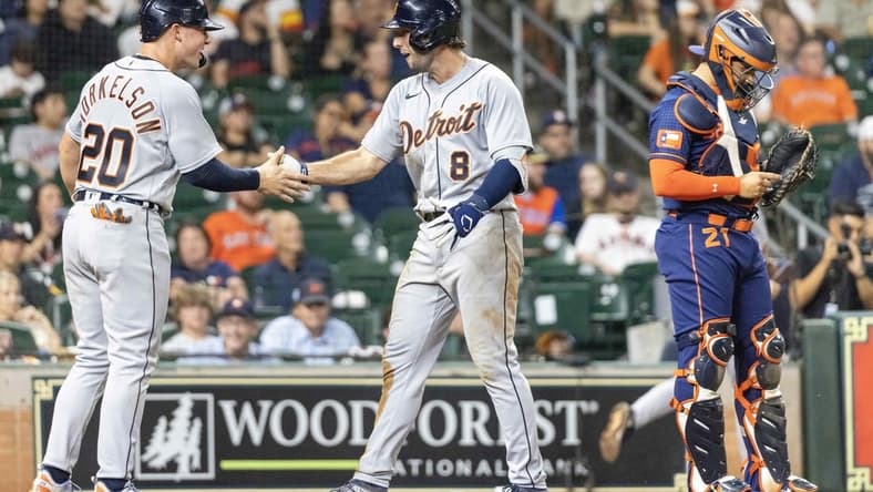 Apr 3, 2023; Houston, Texas, USA; Detroit Tigers first baseman Spencer Torkelson (20) celebrates right fielder Matt Vierling (8) two-run home run against the Houston Astros in the eleventh inning at Minute Maid Park. Mandatory Credit: Thomas Shea-USA TODAY Sports