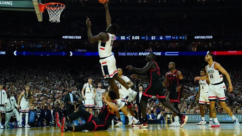 Apr 3, 2023; Houston, TX, USA; Connecticut Huskies forward Adama Sanogo (21) shoots against the San Diego State Aztecs in the national championship game of the 2023 NCAA Tournament at NRG Stadium. Mandatory Credit: Robert Deutsch-USA TODAY Sports