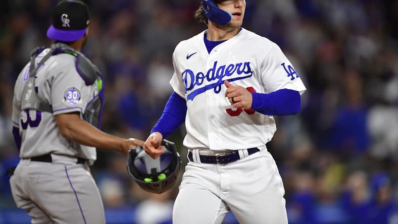 Apr 3, 2023; Los Angeles, California, USA; Los Angeles Dodgers left fielder James Outman (33) scores a run against the Colorado Rockies during the fifth inning at Dodger Stadium. Mandatory Credit: Gary A. Vasquez-USA TODAY Sports