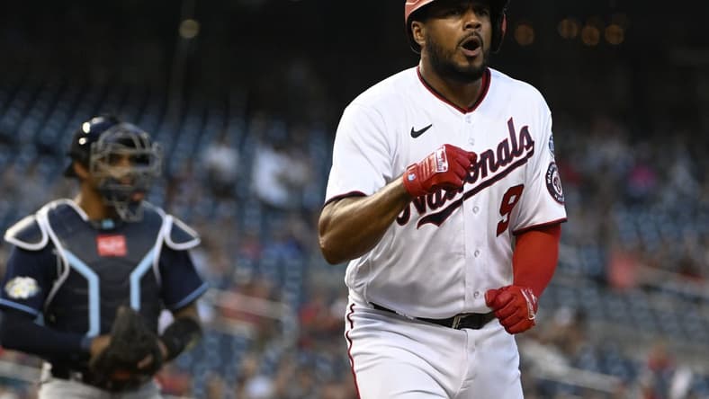 Apr 4, 2023; Washington, District of Columbia, USA; Washington Nationals third baseman Jeimer Candelario (9) reacts after scoring a run against the Tampa Bay Rays during the first inning at Nationals Park. Mandatory Credit: Brad Mills-USA TODAY Sports