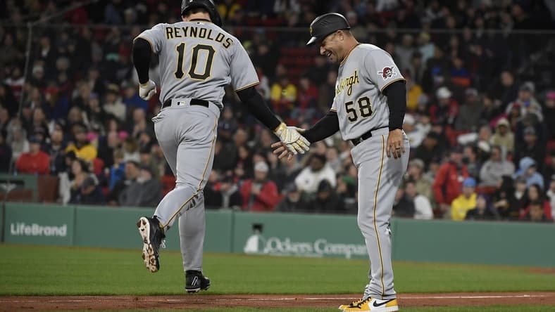 Apr 4, 2023; Boston, Massachusetts, USA;  Pittsburgh Pirates center fielder Bryan Reynolds (10) is congratulated by third base coach Mike Rabelo (58) after hitting a home run during the third inning against the Boston Red Sox at Fenway Park. Mandatory Credit: Bob DeChiara-USA TODAY Sports