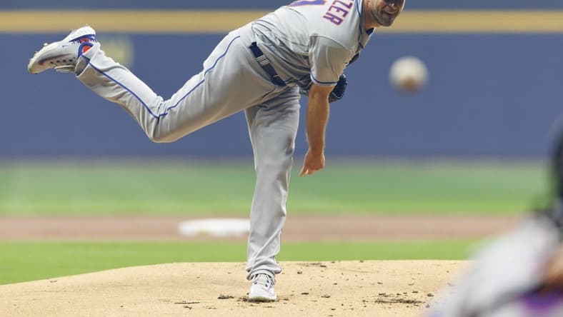 Apr 4, 2023; Milwaukee, Wisconsin, USA;  New York Mets pitcher Max Scherzer (21) throws a pitch during the first inning against the Milwaukee Brewers at American Family Field. Mandatory Credit: Jeff Hanisch-USA TODAY Sports