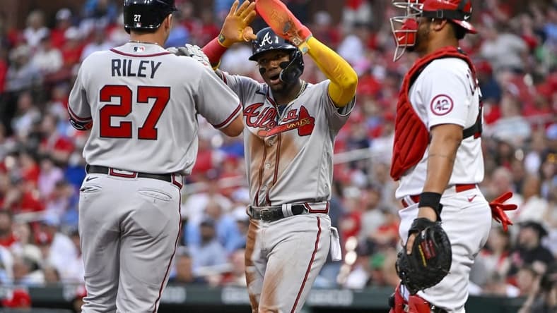 Apr 4, 2023; St. Louis, Missouri, USA;  Atlanta Braves third baseman Austin Riley (27) celebrates with right fielder Ronald Acuna Jr. (13) after hitting a two run home run against the St. Louis Cardinals during the first inning at Busch Stadium. Mandatory Credit: Jeff Curry-USA TODAY Sports