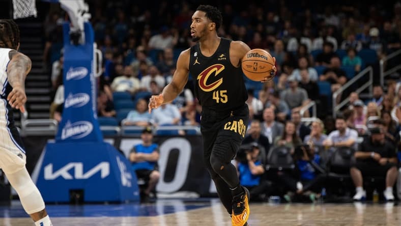 Apr 4, 2023; Orlando, Florida, USA; Cleveland Cavaliers guard Donovan Mitchell looks to pass against the Orlando Magic at Amway Center. Mandatory Credit: Jeremy Reper-USA TODAY Sports
