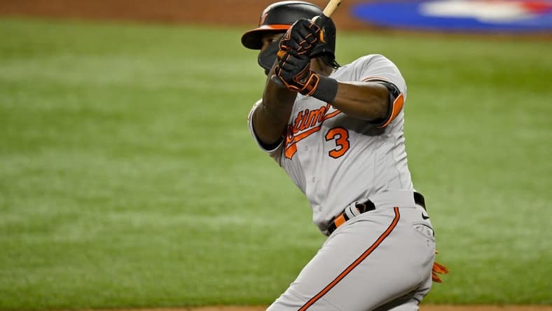 Apr 4, 2023; Arlington, Texas, USA; Baltimore Orioles shortstop Jorge Mateo (3) hits a two run home run against the Texas Rangers during the third inning at Globe Life Field. Mandatory Credit: Jerome Miron-USA TODAY Sports