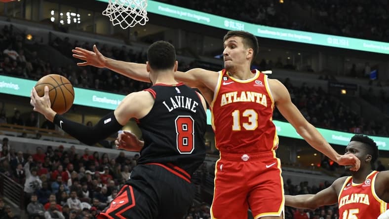 Apr 4, 2023; Chicago, Illinois, USA;  Atlanta Hawks guard Bogdan Bogdanovic (13) defends against Chicago Bulls guard Zach LaVine (8) during the first half at the  United Center. Mandatory Credit: Matt Marton-USA TODAY Sports