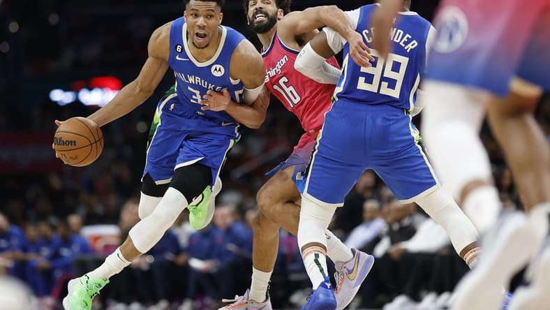 Apr 4, 2023; Washington, District of Columbia, USA; Milwaukee Bucks forward Giannis Antetokounmpo (34) drives to the basket past Washington Wizards forward Anthony Gill (16) in the third quarter at Capital One Arena. Mandatory Credit: Geoff Burke-USA TODAY Sports