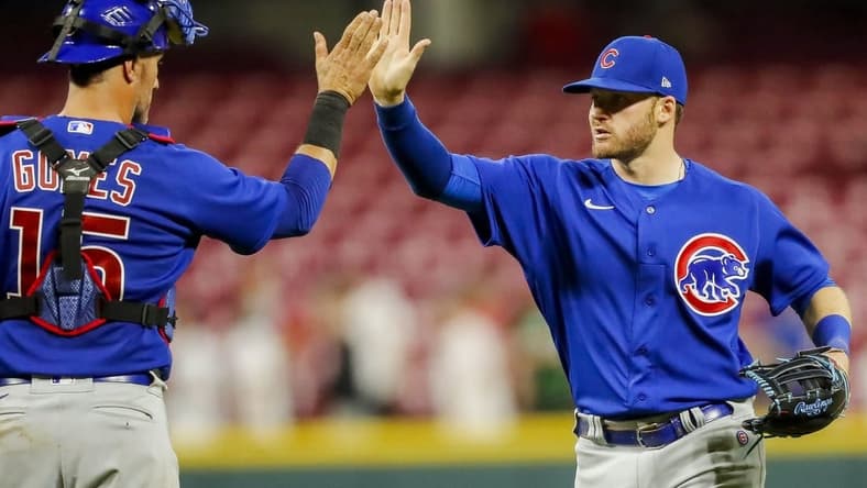 Apr 4, 2023; Cincinnati, Ohio, USA; Chicago Cubs left fielder Ian Happ (8) high fives catcher Yan Gomes (15) after the victory over the Cincinnati Reds at Great American Ball Park. Mandatory Credit: Katie Stratman-USA TODAY Sports