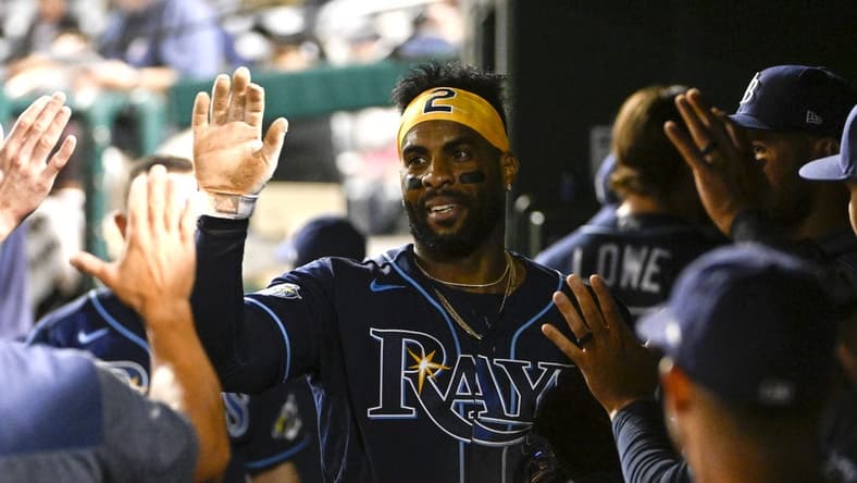 Apr 4, 2023; Washington, District of Columbia, USA; Tampa Bay Rays first baseman Yandy Diaz (2) is congratulated by teammates after scoring a run during the eighth inning against the Washington Nationals at Nationals Park. Mandatory Credit: Brad Mills-USA TODAY Sports