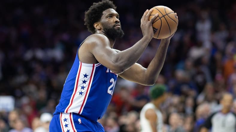 Apr 4, 2023; Philadelphia, Pennsylvania, USA; Philadelphia 76ers center Joel Embiid (21) shoots a technical foul shot against the Boston Celtics during the fourth quarter at Wells Fargo Center. Mandatory Credit: Bill Streicher-USA TODAY Sports