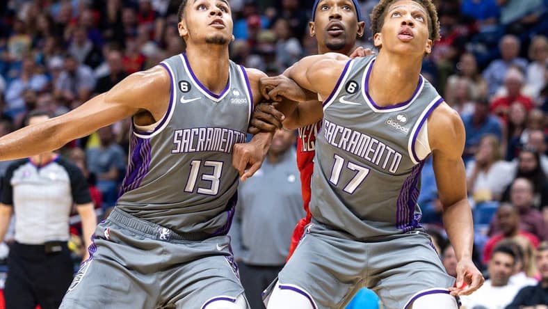 Apr 4, 2023; New Orleans, Louisiana, USA;  Sacramento Kings forward Keegan Murray (13) and forward Kessler Edwards hold back New Orleans Pelicans guard Josh Richardson (2) on a rebound during the second half at Smoothie King Center. Mandatory Credit: Stephen Lew-USA TODAY Sports