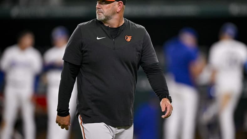 Apr 4, 2023; Arlington, Texas, USA; Baltimore Orioles manager Brandon Hyde (18) walks off the field during the game against the Texas Rangers at Globe Life Field. Mandatory Credit: Jerome Miron-USA TODAY Sports