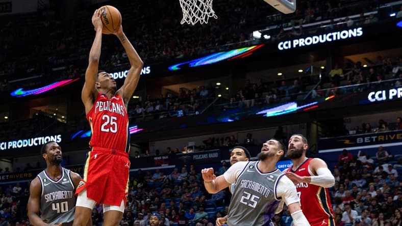 Apr 4, 2023; New Orleans, Louisiana, USA;  New Orleans Pelicans guard Trey Murphy III (25) dunks the ball against Sacramento Kings center Alex Len (25) during the second half at Smoothie King Center. Mandatory Credit: Stephen Lew-USA TODAY Sports